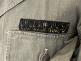 Close-up of a U.S. Army patch on a military uniform jacket.